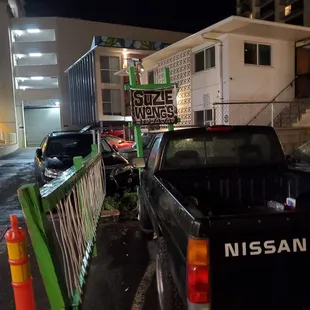 Signage at the front of the parking lot. Giving me some rustic tagger vibes.