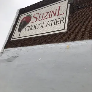 a sign on the side of a building