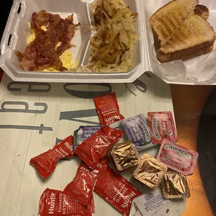 Scrambled eggs, hash browns and bacon
