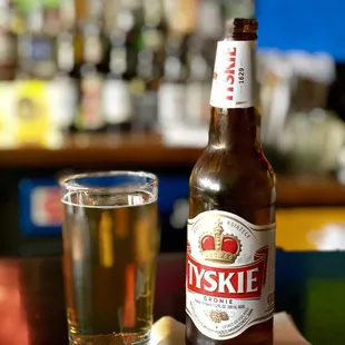 a glass of beer and a bottle