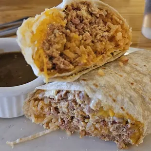 Custom breakfast burrito with chorizo, eggs, rice, and mixed cheese. Decent. A bit mushy. Maybe add in some crispy hashbrowns.