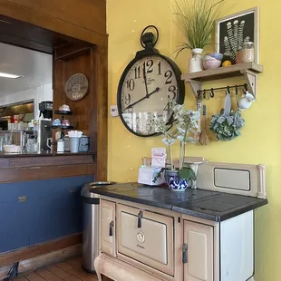 a clock on a yellow wall