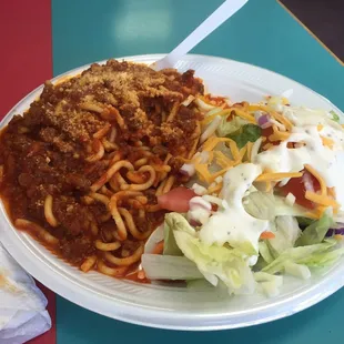 Spaghetti and meat sauce, with salad and Italian garlic bread