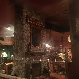 A huge fireplace in center of main room.