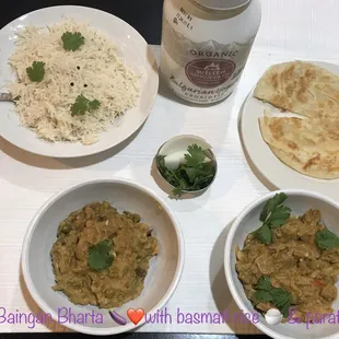 three bowls of food on a table