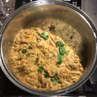 a pot of food cooking on a stove