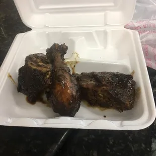 Jerk chicken, curry chicken, macaroni and cheese and rice and beans