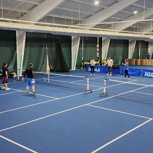 Coach Jacob Beck giving a Beginner Pickleball lesson.