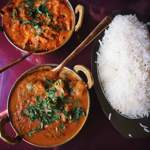 Chicken Tikka Masala (top left). Lamb curry (bottom left). Rice.