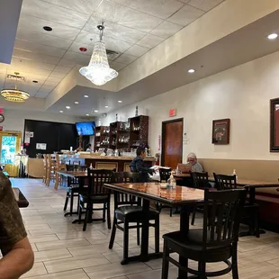 a man sitting at a table in a restaurant