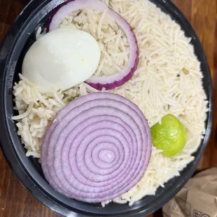 a bowl of rice and onions