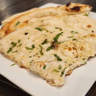 two slices of flatbread pizza