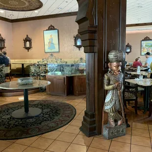 a statue of a woman in a restaurant