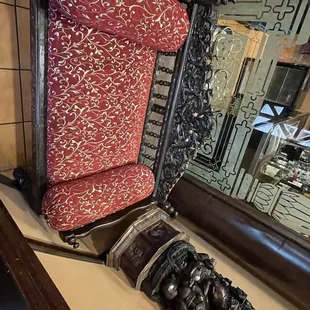 a chair and a mirror in a room