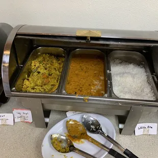 a plate of food and spoons