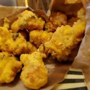 Vegetable Pakora in a brown bag $10