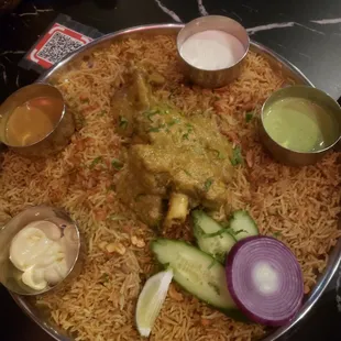 Goat with rice. The sauces were not necessary.