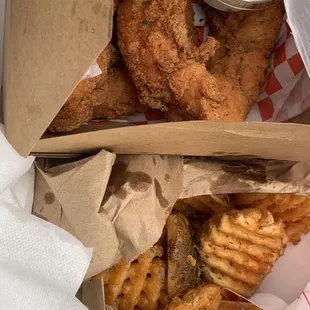 Chicken Strips and Waffle fries. Ranch for dipping and maple syrup for the fries  delicious.