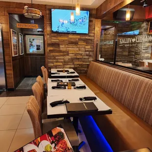 a dining area with tables and chairs