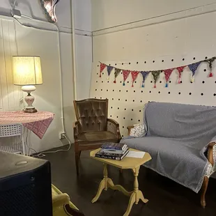 a couch, chair, table, and lamp