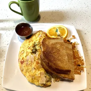 Jalapeño cheese with turkey omelet with hash browns and toast.