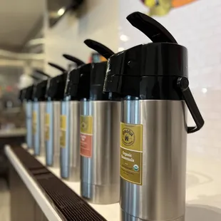 a row of coffee pots