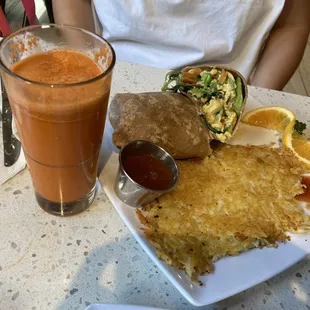 Veggie Egg Burrito with hash browns and a Carrot Juice