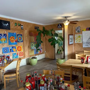 a dining area with tables and chairs