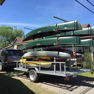 His trailer full of maintained canoes and kayaks