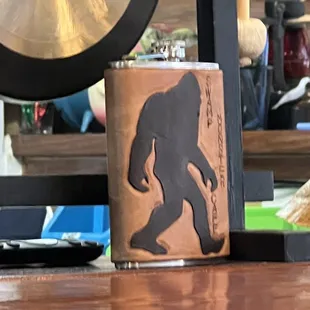 a hip flask and a gong