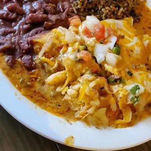 Seafood enchiladas, red beans and dirty ricw