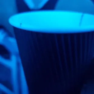 a person holding a cup of coffee