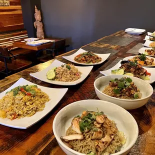 a long table with bowls of food