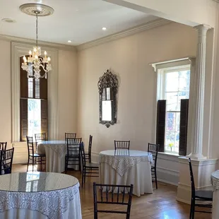 a dining room with tables and chairs