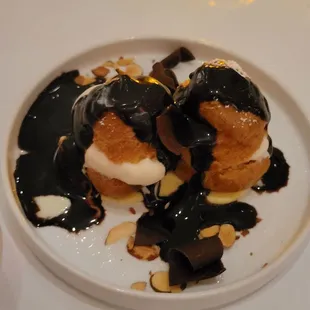 Hot fudge profiterole dessert