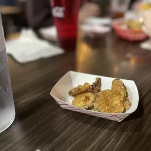 a plate of fried chicken on a table