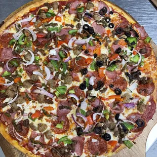 a pizza on a cutting board