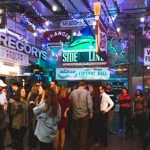 a crowd of people standing in line