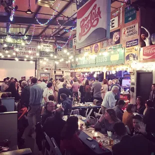a large crowd of people eating and drinking