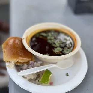 a bowl of soup and a sandwich