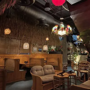 Outside the pirate ship. Beachy furniture and delightfully kitschy parrot and puffer fish light fixtures!