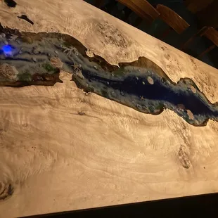 Cool table with a seascape under varnish.