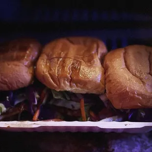 three sandwiches in a basket