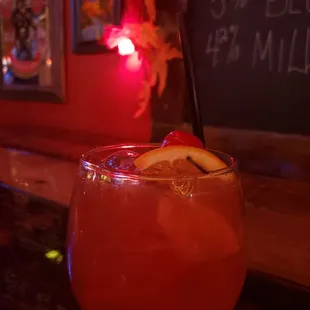 a drink in a glass on a bar