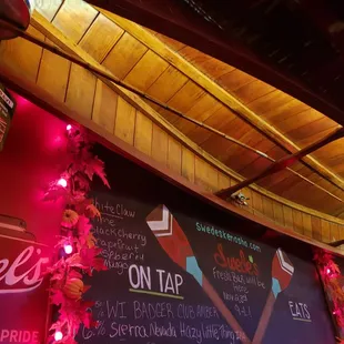 a menu on the wall of a restaurant