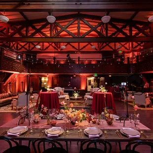 tables and chairs set for dinner
