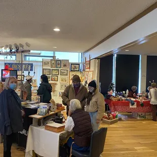 people at tables in a large room