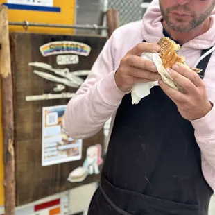 a man eating a hot dog