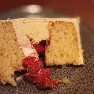 a piece of cake with raspberry filling