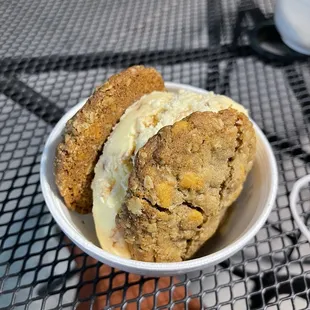a bowl of ice cream and a cookie